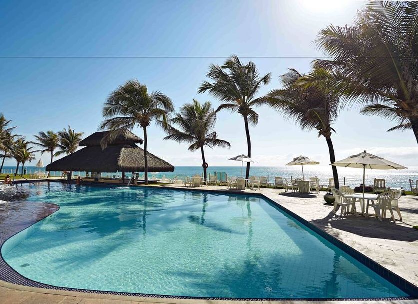El Aram Natal Mar pool with palm trees and ocean view in Natal