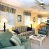 Pawleys Plantation Golf & Country Club living room suite in Pawleys Island with sofa, chairs and kitchen
