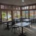 Quality Inn Pittsburgh Airport in Oakdale breakfast room with large windows and tables