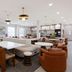 Home2 Suites by Hilton South Padre Island lobby lounge with seating and kitchen area