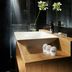Suite Art Navona Rome bathroom with rainfall shower, wood vanity and flower vase