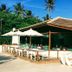 Sueds Plaza in Porto Seguro with a poolside open-air restaurant and white umbrellas