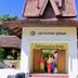 Oriental Siam Resort in Chiang Mai entrance with three people standing by the doorway