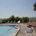 Gulf Towers Resort Motel in Indian Rocks Beach with pool, lounge chairs, and ocean view