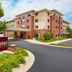 The Q Hotel & Suites in Springfield exterior with entrance drive and sign