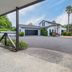 73 Milton, Cambridge: exterior view of a white house-style hotel with driveway, garage and palm trees
