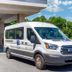 Spark by Hilton Atlanta Airport South College Park shuttle van parked at the hotel entrance