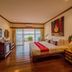 Chiangkhan River Mountain Resort room with king bed and river-view balcony in Chiang Khan