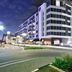 The Capital Menlyn Maine hotel exterior in Pretoria at night with modern facade and city street
