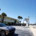 Studio 1 Motel in Daytona Beach with palm trees, parked cars and a two-story exterior