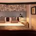 Greswolde Arms by Chef & Brewer Collection in Solihull bedroom with king bed, patterned headboard and bedside lamps