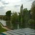 Hotel Restaurant L'esturgeon, Poissy, river view with trees and walkway beside the water