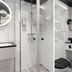 Best Western Hotel at 108 in Stockholm bathroom with glass shower, twin sinks and round lit mirrors