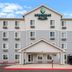 WoodSpring Suites San Antonio South exterior in San Antonio with covered entrance and parking lot