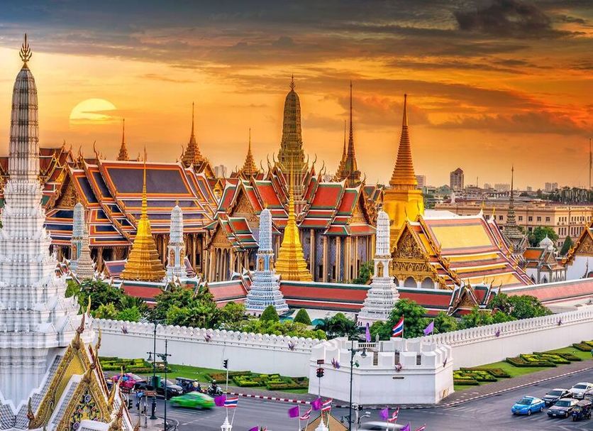 Sala Rattanakosin Bangkok in Bangkok with sunset view of ornate temple spires across the river