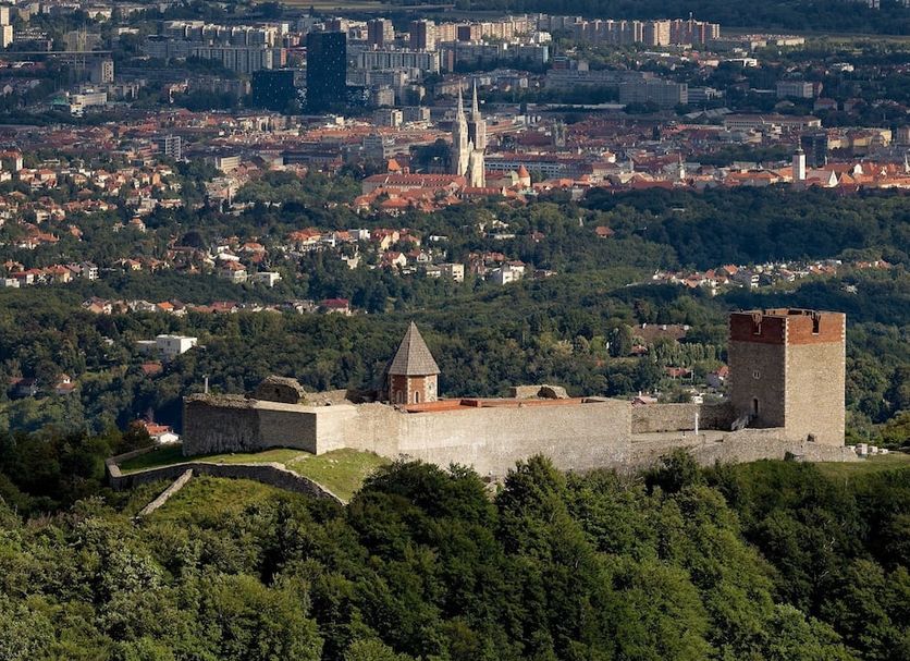 Hotel Tomislavov Dom in Zagreb with a hilltop stone fortress overlooking the city skyline