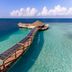 Hurawalhi Island Resort in Komandoo with overwater walkway to a lagoon-side pavilion