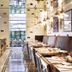 Tamani Marina Hotel and Hotel Apartments Dubai dining room with long tables and pendant lights