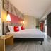 ibis Xi'an North Railway Station Hotel in Xi'an room with bed, floor-to-ceiling window and city view