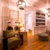 La Palmeraie in La Baule-Escoublac lounge with armchairs, pendant lights, wine display and wooden tables