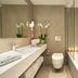Mystery Skiathos Luxury Residence bathroom with bathtub, vanity, toilet and orchids in Skiathos