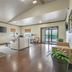Best Western Timberridge Inn in Grove lobby lounge with seating, TV, and glass doors to patio
