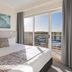 Ramada Resort by Wyndham Shoal Bay bedroom with balcony and water view in Shoal Bay
