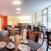 Hotel Carolinenhof Berlin dining room with tables, chairs, and buffet area