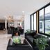 Arawana Regency South Pattaya lobby with black seating and large windows in Pattaya