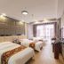 OYO Hexi Hotel in Zhangye guest room with two beds and large window