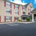 Country Inn & Suites by Radisson Harrisburg Northeast exterior with covered entrance and parking lot