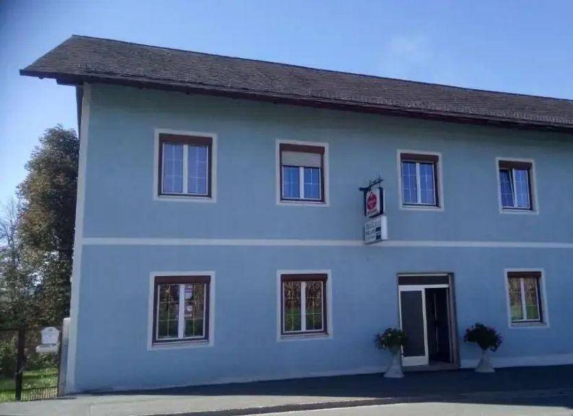 Gästehaus Klug in Sankt Stefan ob Stainz, blue two-story guesthouse exterior with multiple windows