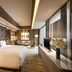 DoubleTree by Hilton Hotel Jakarta - Diponegoro guest room with king bed, sofa, and city view in Jakarta