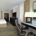 Holiday Inn Metairie New Orleans By IHG guest room with king bed, desk and TV
