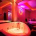 Cupid Hotel in Ho Chi Minh City room with heart-shaped hot tub, neon lighting and bed