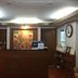 Chada Thai House Pattaya reception desk with floral wall art and seating area