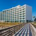 Holiday Inn Express Pensacola Beach By IHG exterior with boardwalk leading to the beachfront hotel