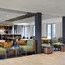 Courtyard by Marriott Boston Norwood/Canton lobby lounge with seating and bar area in Norwood