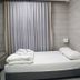 Hi Rabin - Jerusalem Hostel room with single bed, desk, and curtains in Jerusalem