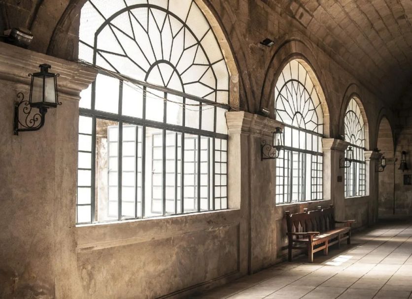 Great Eastern Hotel Quezon City in Manila, arched corridor with large windows and benches
