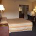 Executive Inn Rocky Top room with double bed, desk, TV and dresser