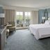 The Grand Hotel Golf Resort & Spa, Autograph Collection bedroom in Point Clear with balcony and golf course view