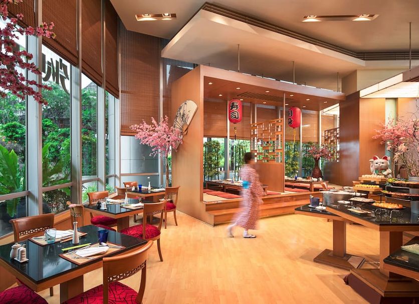 Prince Palace Hotel Bangkok restaurant with garden views and buffet tables in Bangkok