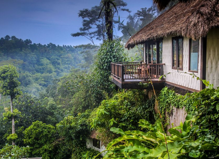 Nandini Jungle by Hanging Gardens in Payangan, hillside villa balcony above lush jungle