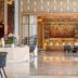 Waldorf Astoria Riviera Maya in Cancún lobby lounge with colorful bar and polished marble floor