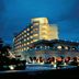 The Gateway Hotel Beach Road in Visakhapatnam at dusk with lit balconies and arched terraces