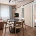 Sky Hotel Apartments Stockholm apartment suite with dining table, sofa, TV, and bedroom doorway