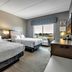 Hampton Inn Buffalo - Amherst guest room with two beds and a window view in Amherst