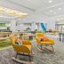 Spark by Hilton Mechanicsburg Harrisburg West lobby lounge with seating area and breakfast bar in Mechanicsburg