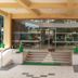 Seven Sky Clarks Exotica Bhuj hotel entrance with steps, glass doors and covered driveway